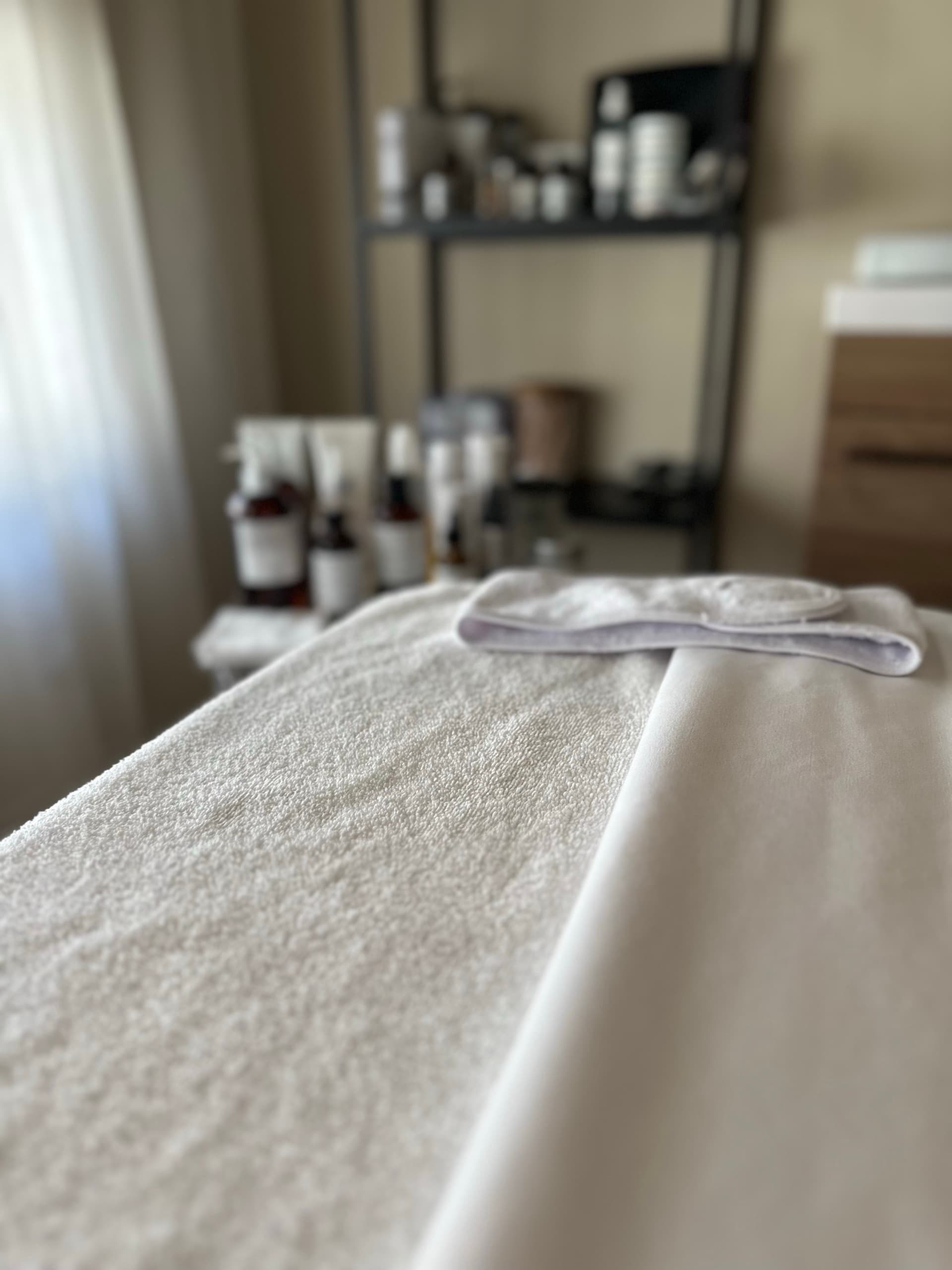 Close-up of the treatment bed with fresh linens